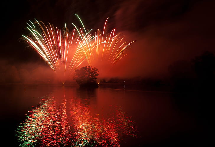 landscape photo of fireworks in the sky near water formation during nighttime, HD wallpaper