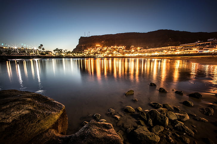 black rocks on body of water near city lights under blue sky during sunset, gran canaria, canary islands, gran canaria, canary islands, HD wallpaper