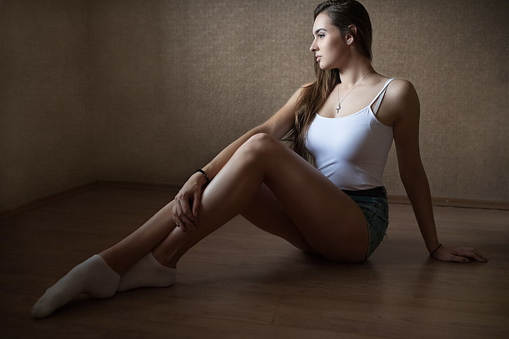 women's white tankt top, socks, jean shorts, tanned, sitting