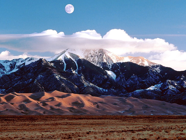 mountain under blue sky digital wallpaper, moon, mountains, sand