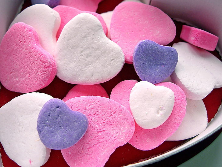 Love heart-shaped candy, purple, white and pink heart candies in box