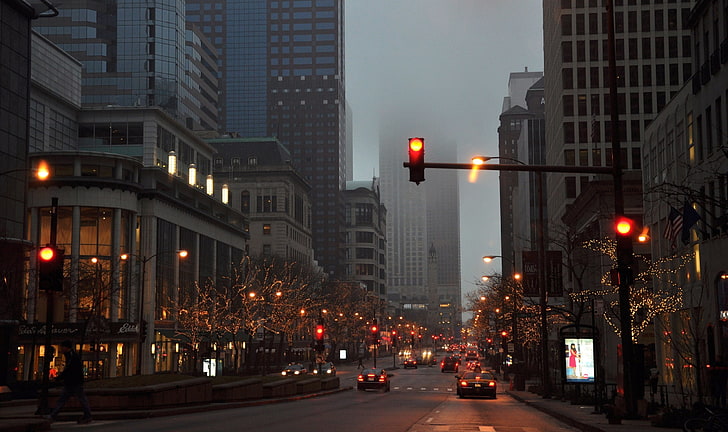 black traffic light, road between high-rise buildings, urban
