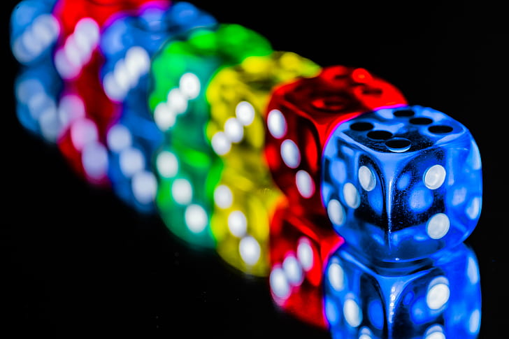 blue, green, red, and yellow dice on black surface, HMM, Colorful
