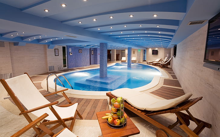 Inside Pool, indoor pool; two brown wooden loungers, interior design