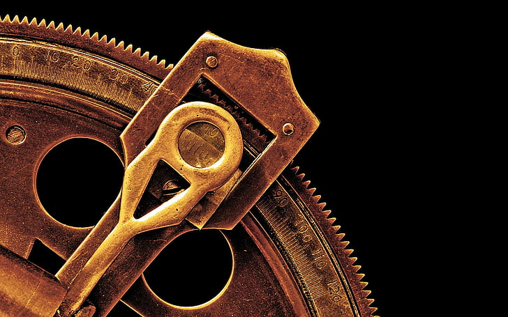 brass-colored key, photography, macro, machine, vintage, black background