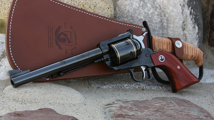 black revolver with brown leather holster, Ruger Super Blackhawk .44 Magnum