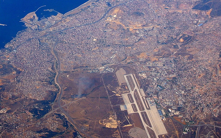 brown and black concrete building, city, aerial view, airfield