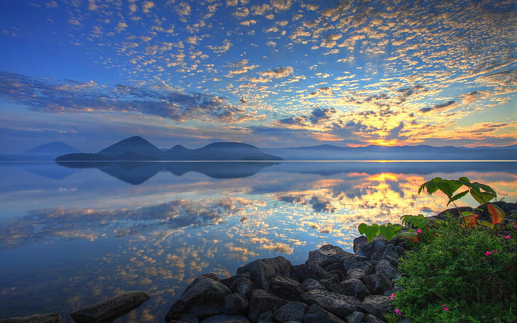 Lake Toya, Hokkaido, Japan, sunrise, clouds, blue sky and yellow clouds