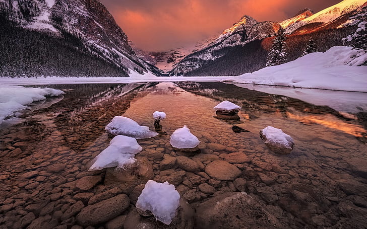 Canada, Alberta, Banff National Park, rocky mountains, glacial lake, snow, river between snow covered mountain photo