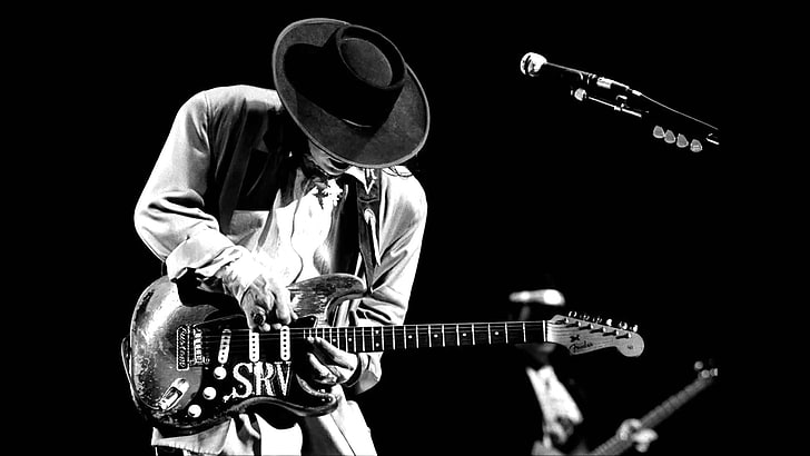 greyscale photo of musician, Stevie Ray Vaughan, guitar, blues rock