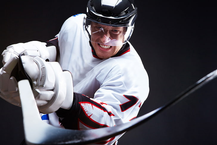 white and black ice hockey stick, grin, black background, sport