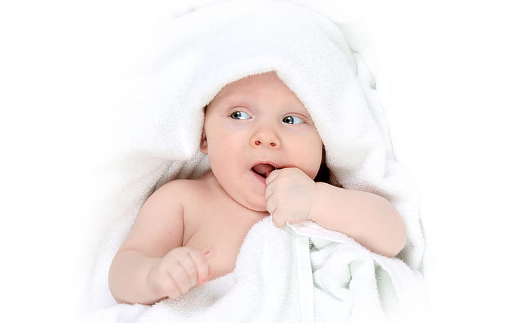 Cute baby shifted attention, baby's white towel