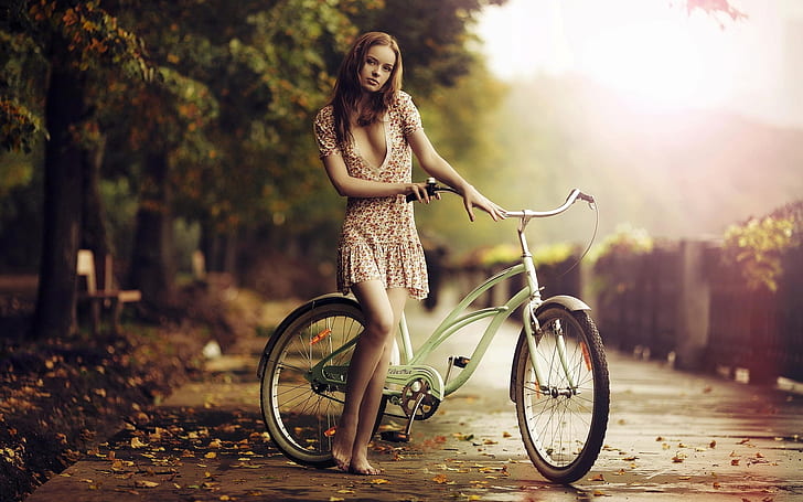 Beautiful barefoot girl, bicycle, fall, green cruiser bicycke