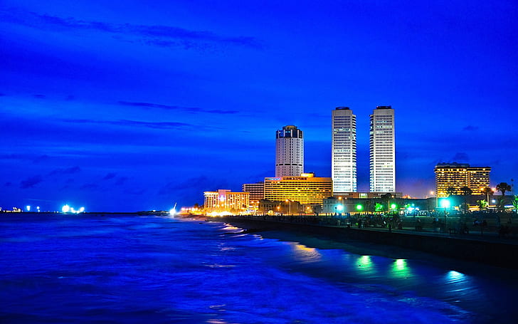 Sri Lanka coast city at night, skyscrapers, lights, twin tower world trade center