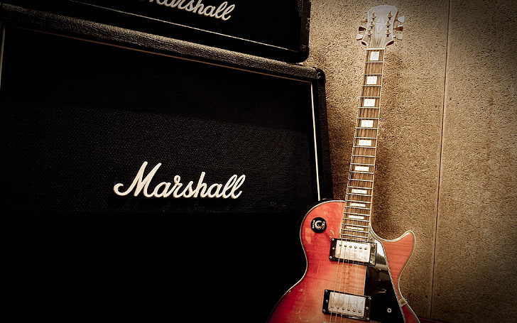 black Marshall guitar amplifier and red electric guitar, musical instrument