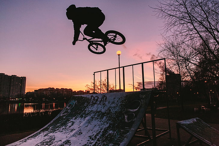 BMX bike silhouette photo, cyclist, trick, city, sky, sport, extreme sports
