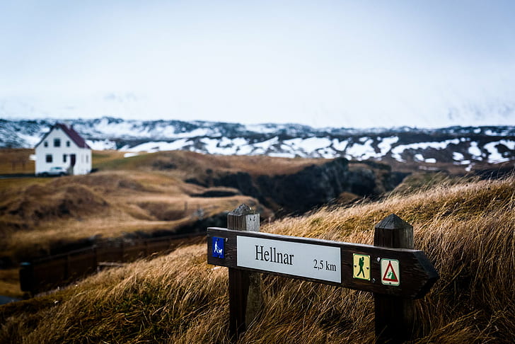 selective focus photography of Hellnar 2.5 KM signage, hellnar