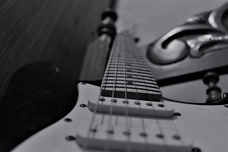 white and black electric guitar, monochrome, musical instrument