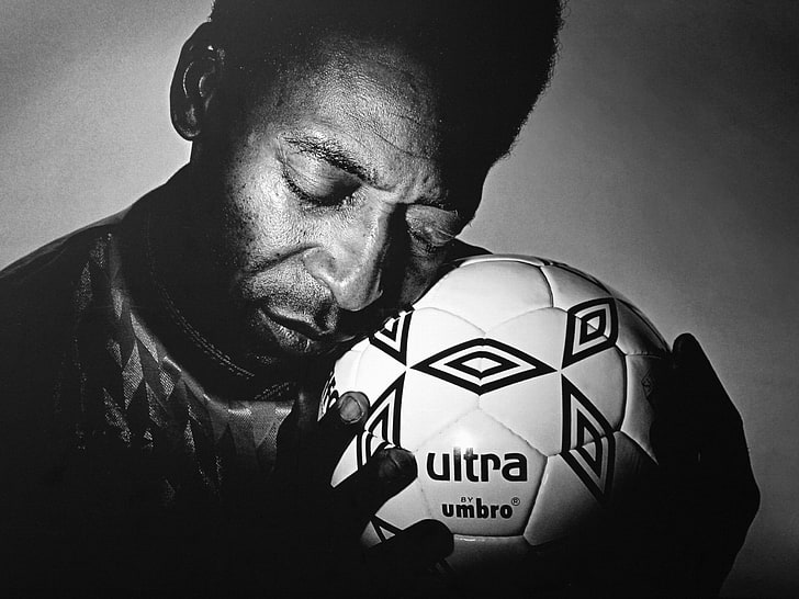 grayscale photography of man holding soccer ball, love, hands