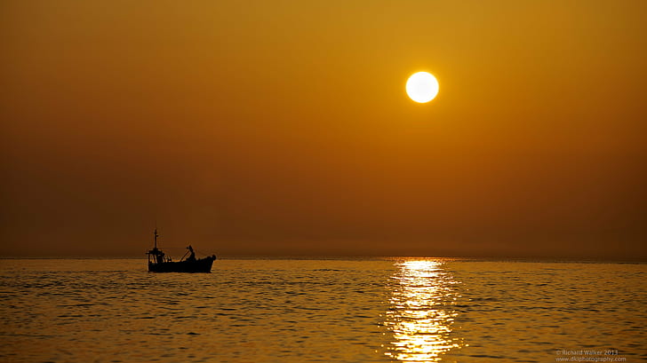silhouette of boat on sea during golden hour, st ives, st ives