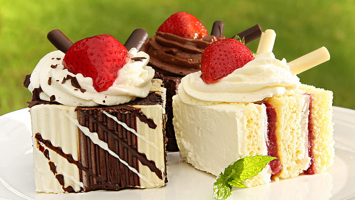 Sweet cakes, cream, strawberries, delicious food