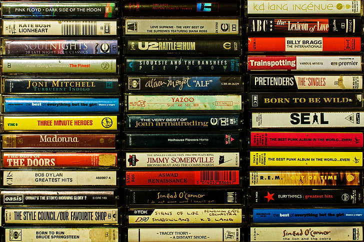 assorted-title DVD case, music, cassette, nostalgia, in a row
