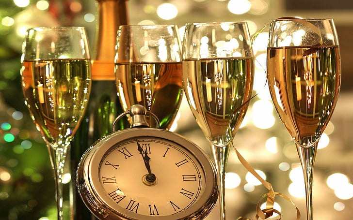 Midnight celebration, gray pocket watch and four wine glasses