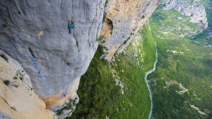 person's green shirt, climbing, canyon, bird's eye view, heights