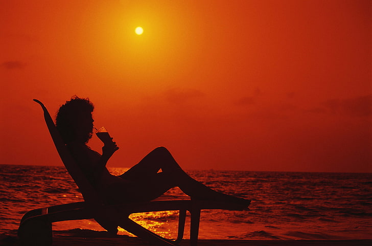silhouette of woman and lounger, girl, recreation, sea, sunset