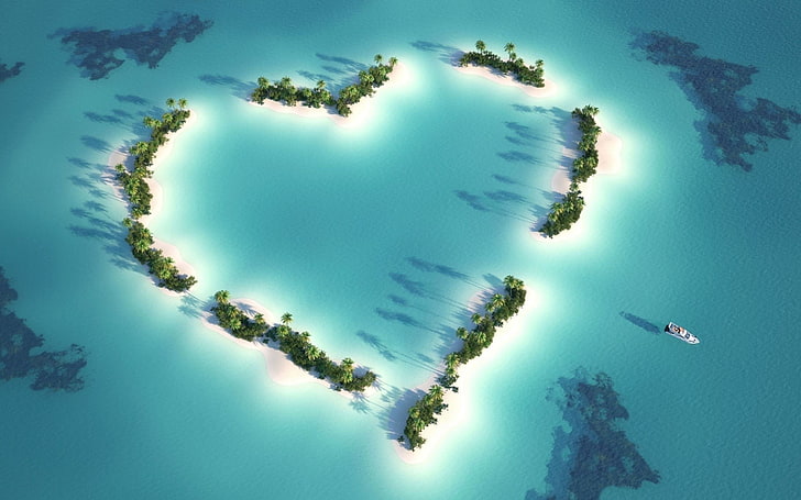 green heart shape trees on body of water, island, aerial view