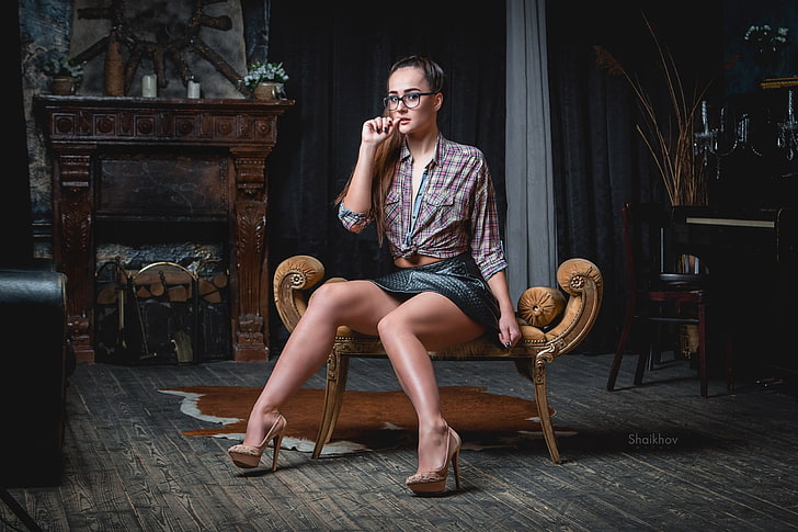 women's gray sport shirt, sitting, skirt, glasses, high heels